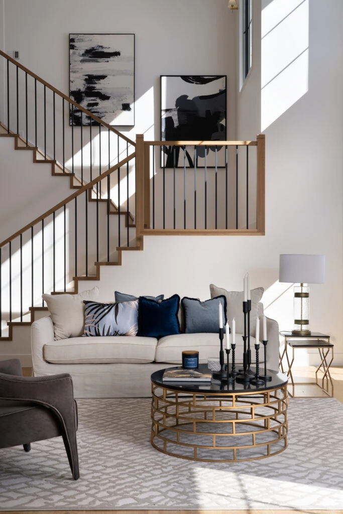 Luxury living room with feature staircase and unique table