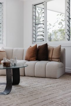 Living space with comfortable sofa and neutral rug