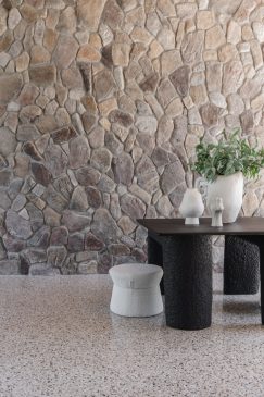 Stone aesthetic wall in a modern dining room