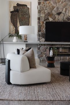 Close up of the textures and details in a modern styled living space with rug, side table and comfy seating