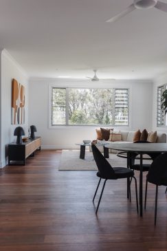 Open plan dining, living space styled with unique pieces.